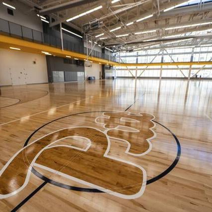 A backetball court with the Pitt script.